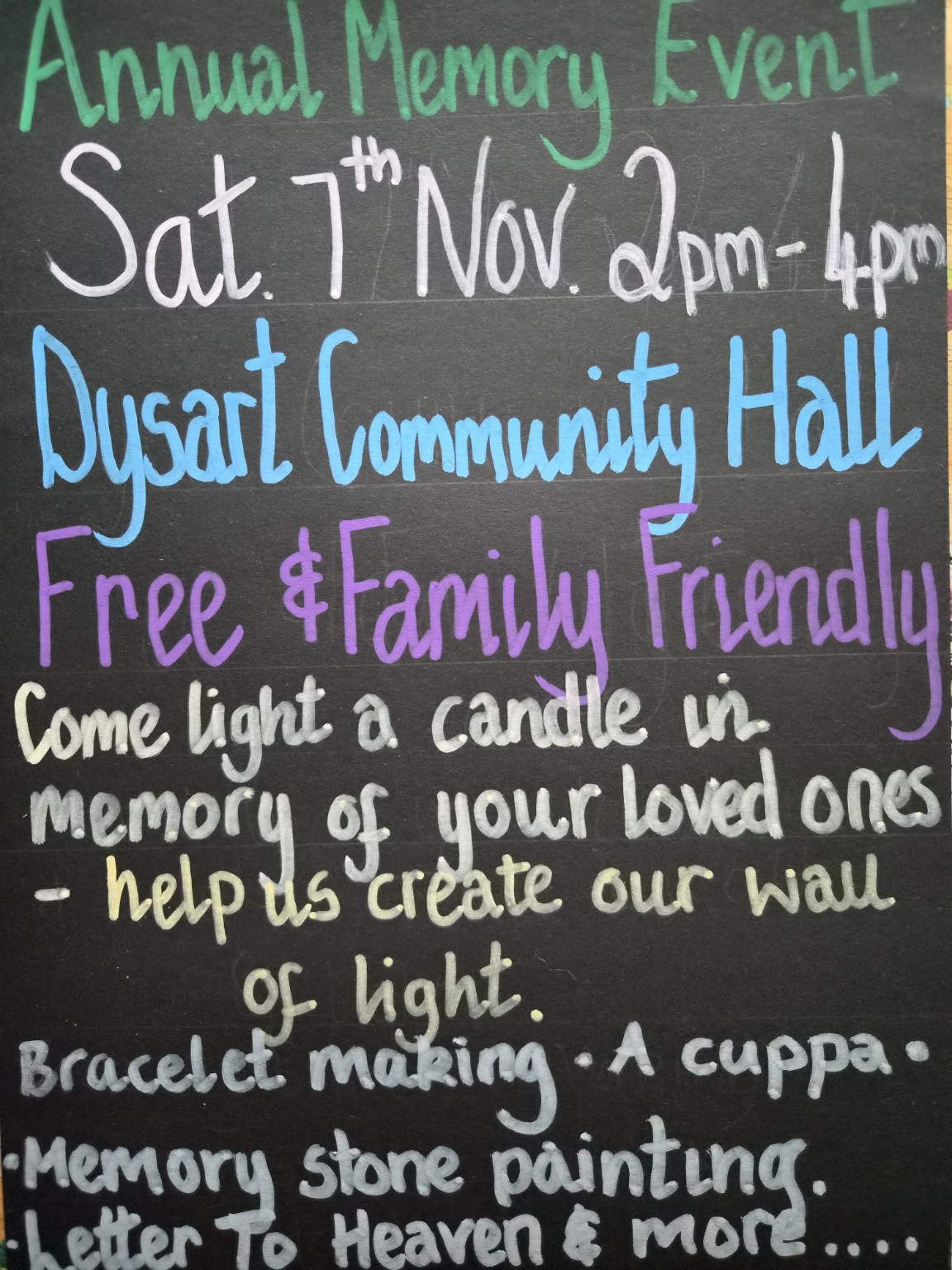 Handwritten chalkboard sign for the Annual Memory Event