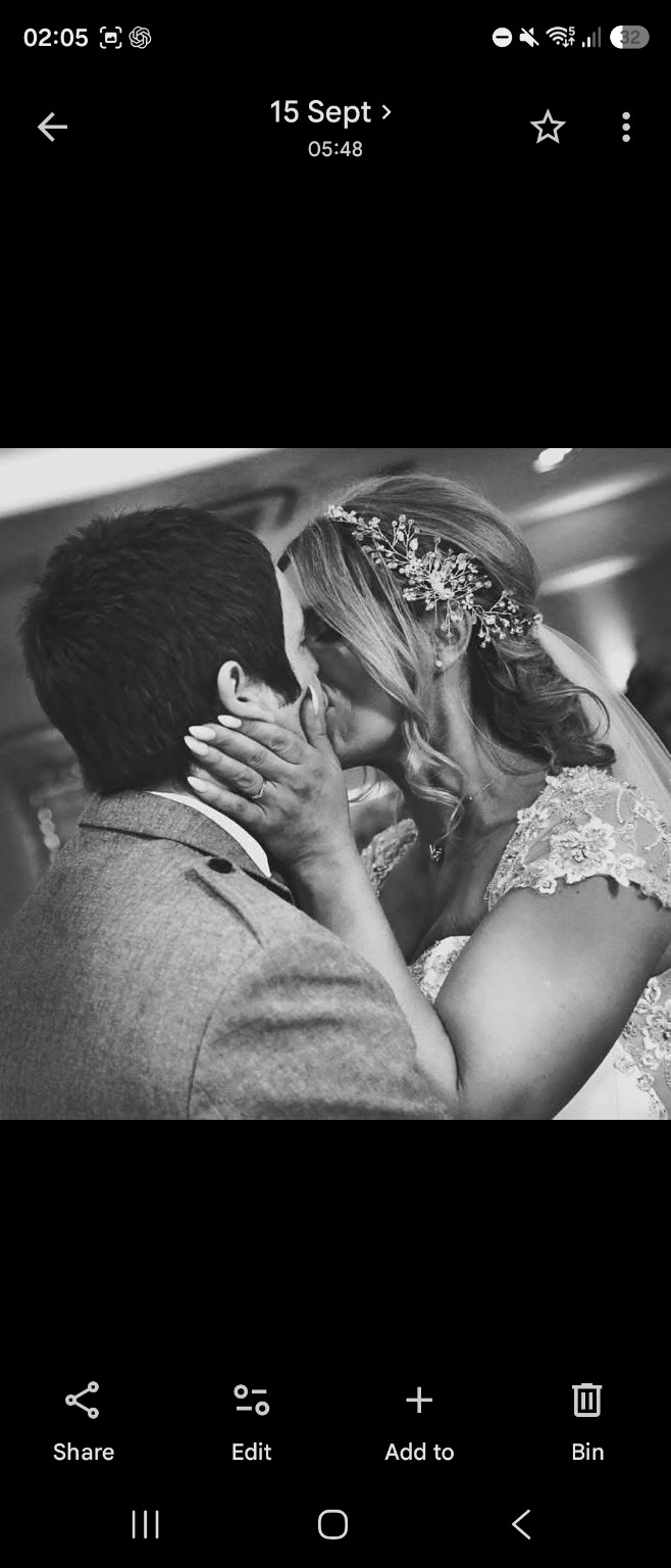 A newly married couple sharing a kiss
